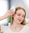 Bärbar massageapparat för huvud och hårbotten